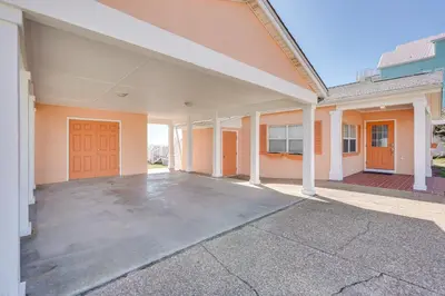 an empty parking lot outside of a building at Breezy PCB Retreat with Direct Beach Access! in Panama City Beach