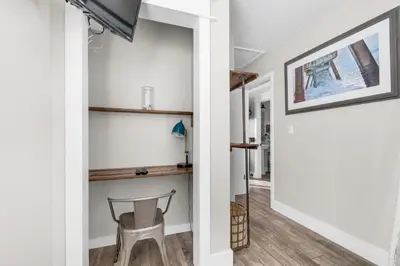a hallway with a chair and a desk in a house at Sand Castles West II G4- FinView in Panama City Beach