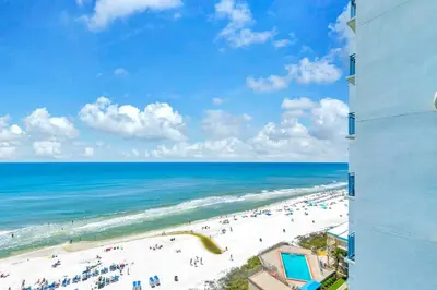 a view of the beach from a building at Sterling Breeze 904 in Panama City Beach