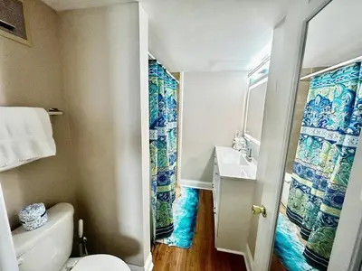 a small bathroom with a toilet and a sink at The Summit 1432 in Panama City Beach