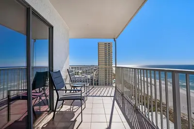 a balcony with chairs and a view of the ocean at The Summit 1432 in Panama City Beach