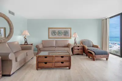 a living room with a couch and a chair at Edgewater Tower 2-307 in Panama City Beach