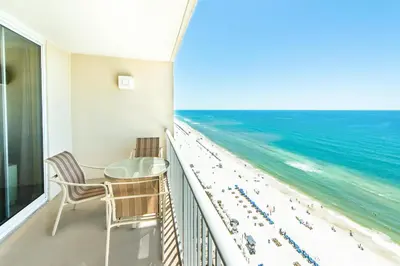 a balcony with a view of the beach and ocean at Majestic Beach Towers 1-1706 in Panama City Beach