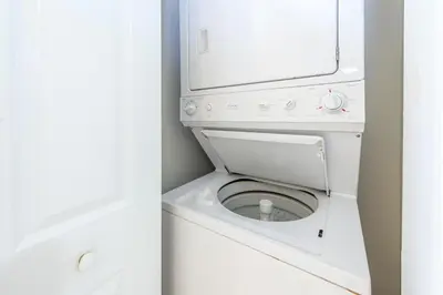 a white washer and dryer in a bathroom at Majestic Beach Towers 1-1706 in Panama City Beach