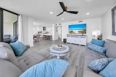 a living room with a couch and a table at Edgewater Tower 2-407 in Panama City Beach