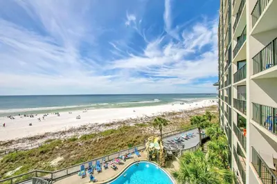 a view of the beach from the balcony of a resort at Edgewater Tower 2-407 in Panama City Beach