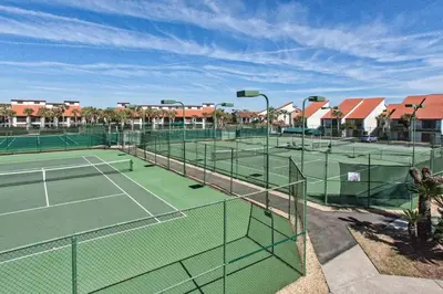 a tennis court with two tennis courts at Edgewater Tower 2-407 in Panama City Beach