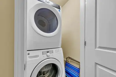 a washer and dryer in a small room at Sterling Breeze 802 in Panama City Beach