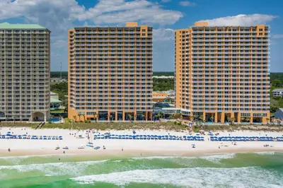 a beach in front of two tall buildings at Splash 1802E in Panama City Beach