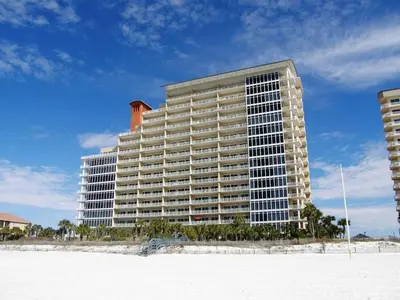 a large building on the beach next to the ocean at Sterling Beach #602 in Panama City Beach