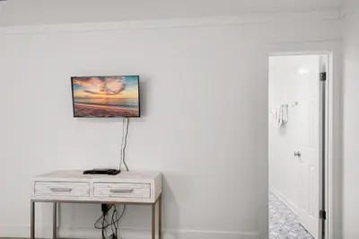 a room with a table and a picture on the wall at SeaRenity at Inlet 2 in Panama City Beach