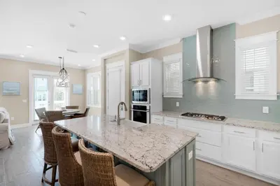 a kitchen with white cabinets and a counter top at Town of Prominence 326B- Seaside Paradise in Santa Rosa Beach