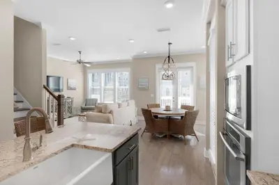 a kitchen and living room with a table and a couch at Town of Prominence 326B- Seaside Paradise in Santa Rosa Beach