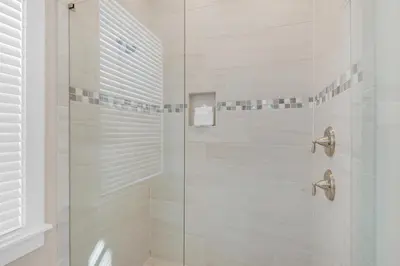 a bathroom with a shower with a glass door at Town of Prominence 326B- Seaside Paradise in Santa Rosa Beach