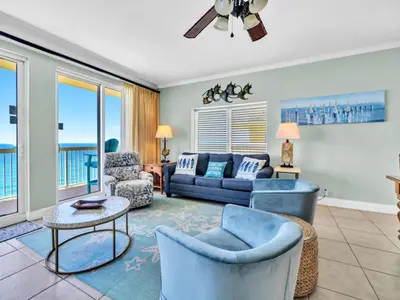 a living room with a couch and chairs at Calypso 1-2109 East in Panama City Beach
