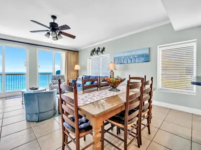 a dining room with a table and chairs at Calypso 1-2109 East in Panama City Beach
