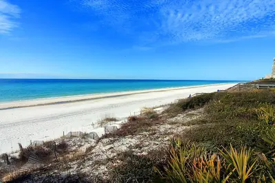 a view of a beach with the ocean in the background at Village of South Walton B375 in Seacrest