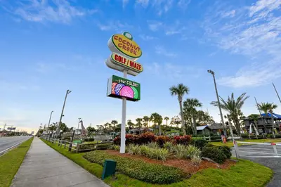 a sign for a fast food restaurant on a street at Majestic Beach Resort #204-2 by Book That Condo in Panama City Beach