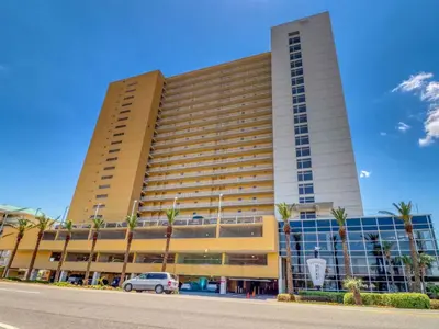 a large building with a car parked in front of it at Sterling Reef #305 in Panama City Beach