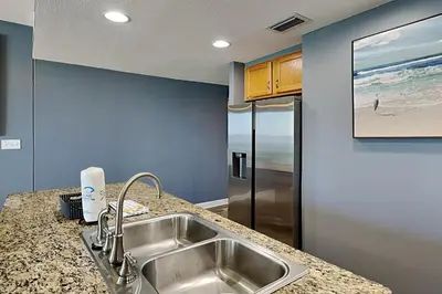 a kitchen with a sink and a counter top at Sterling Reef #305 in Panama City Beach