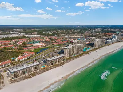 an aerial view of a beach with buildings and the ocean at Latitude Adjustment by Book That Condo in Panama City Beach