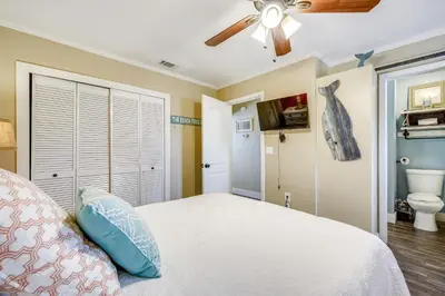 a bedroom with a bed and a ceiling fan at Gulf Highlands 170 by Book That Condo in Panama City Beach