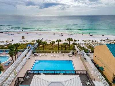 a view of the beach from the balcony of a resort at Gulf Highlands 170 by Book That Condo in Panama City Beach