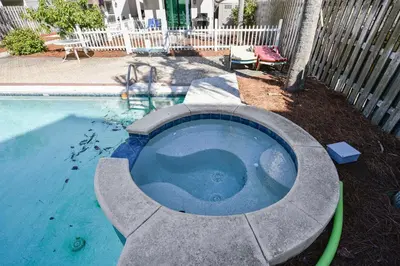 a small swimming pool with a water hose at Beaches and Dreams by Book That Condo in Panama City Beach
