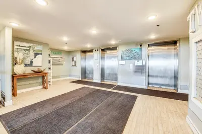 a large hallway with glass doors and a rug at Twin Palms Resort 1604 by Book That Condo in Panama City Beach