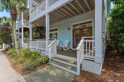 a house with white stairs and a porch at Aquanut Beach House 30A in Inlet Beach
