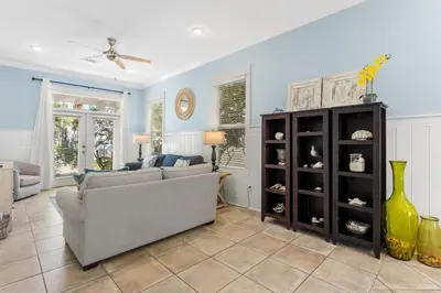 a living room with a couch and a table at Aquanut Beach House 30A in Inlet Beach