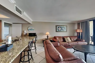 a living room with a couch and a table at Edgewater Tower II #205 in Panama City Beach
