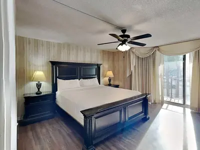 a bedroom with a bed and a ceiling fan at Edgewater Tower 1 Unit 101 in Panama City Beach