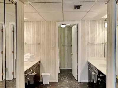 a large bathroom with two sinks and a shower at Edgewater Tower 1 Unit 101 in Panama City Beach