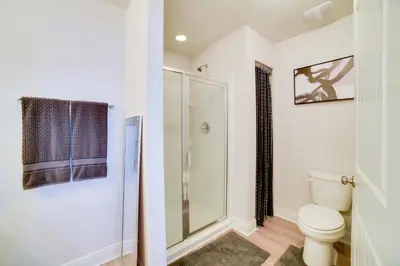 a bathroom with a shower and a toilet at Beautiful PCB Getaway Less Than 3 Mi to the Beach! in Panama City Beach