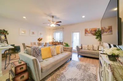 a living room with a couch and a table at Beautiful PCB Getaway Less Than 3 Mi to the Beach! in Panama City Beach
