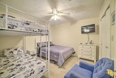 a bedroom with two bunk beds and a ceiling fan at 2 Mi to Beach! Bayside PCB Escape with Pool Access in Panama City Beach