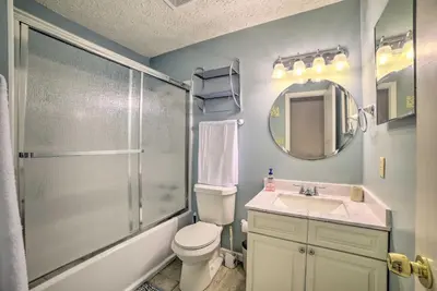 a bathroom with a shower and a toilet and a sink at 2 Mi to Beach! Bayside PCB Escape with Pool Access in Panama City Beach
