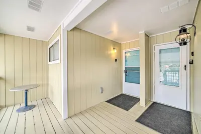 an empty hallway with a door and a stool at 2 Mi to Beach! Bayside PCB Escape with Pool Access in Panama City Beach
