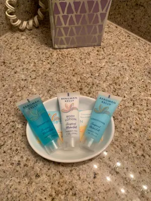 three tubes of sunscreen on a plate on a counter at 1717 Laketown Wharf 1 King Bedroom, 2 Bath in Panama City Beach