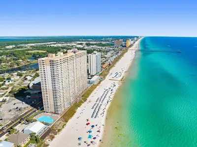 an aerial view of a beach with buildings and the ocean at Tidewater 302 in Panama City Beach