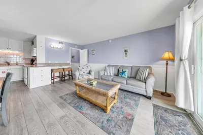 a living room with a couch and a table at The Summit 928 in Panama City Beach