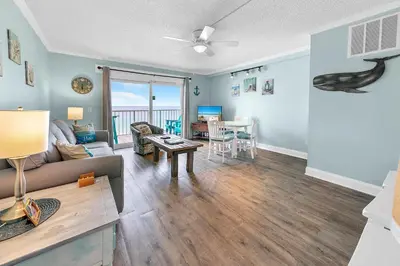 a living room with a couch and a table at The Summit 924 in Panama City Beach