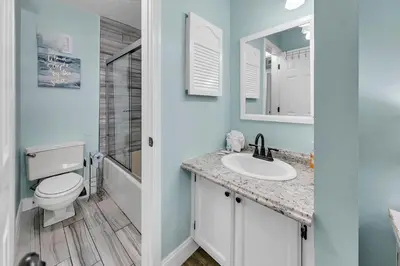 a bathroom with a toilet and a sink at The Summit 924 in Panama City Beach