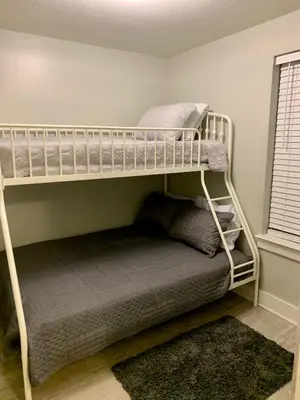 a bedroom with two bunk beds in a room at Sunset Cove at Calypso III in Panama City Beach