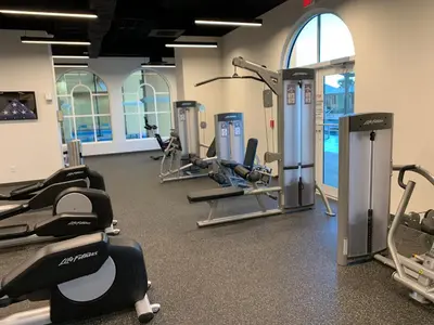 a gym with treadmills and cardio machines in it at Sunset Cove at Calypso III in Panama City Beach
