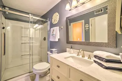 a bathroom with a shower and a toilet and a sink at Beautiful PCB Townhome Balcony and Resort Amenities in Panama City Beach