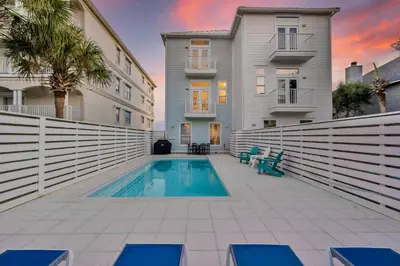 a swimming pool in the courtyard of a house at Beach Love in Santa Rosa Beach