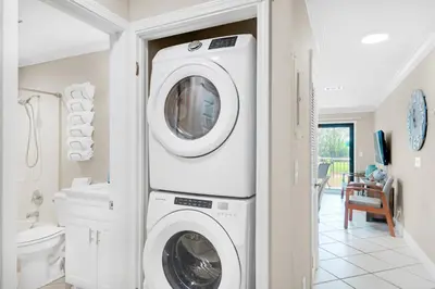 a white washer and dryer in a bathroom at Nautical Watch E-4 in Panama City Beach