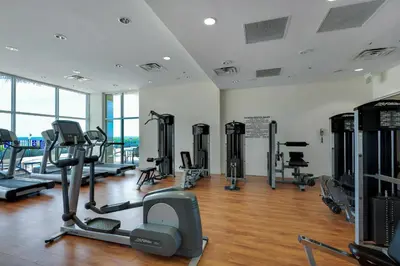 a gym with treadmills and cardio equipment in a building at Sterling Breeze 1401 in Panama City Beach